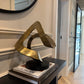 Ribbon Knot Sculpture on Black Wooden Base
