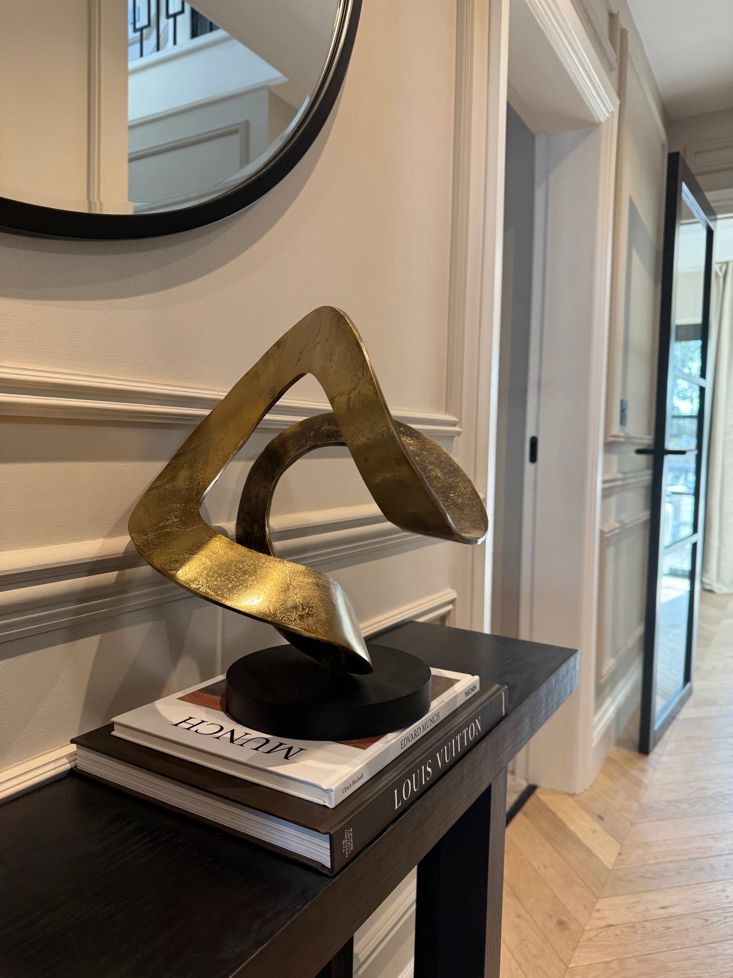 Ribbon Knot Sculpture on Black Wooden Base