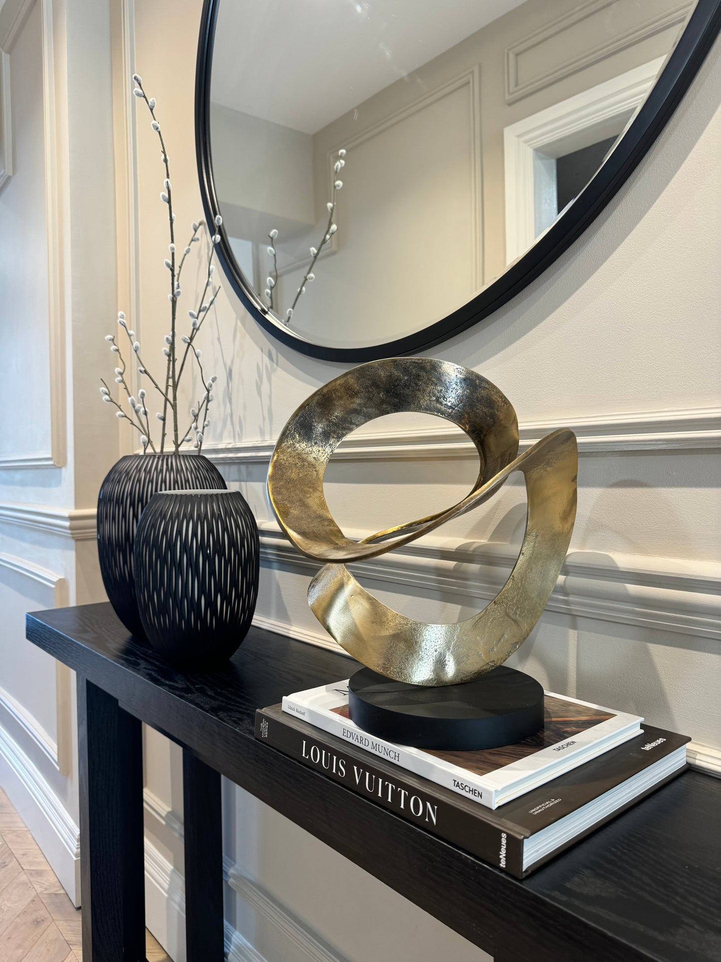 Ribbon Knot Sculpture on Black Wooden Base