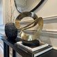 Ribbon Knot Sculpture on Black Wooden Base