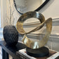 Ribbon Knot Sculpture on Black Wooden Base